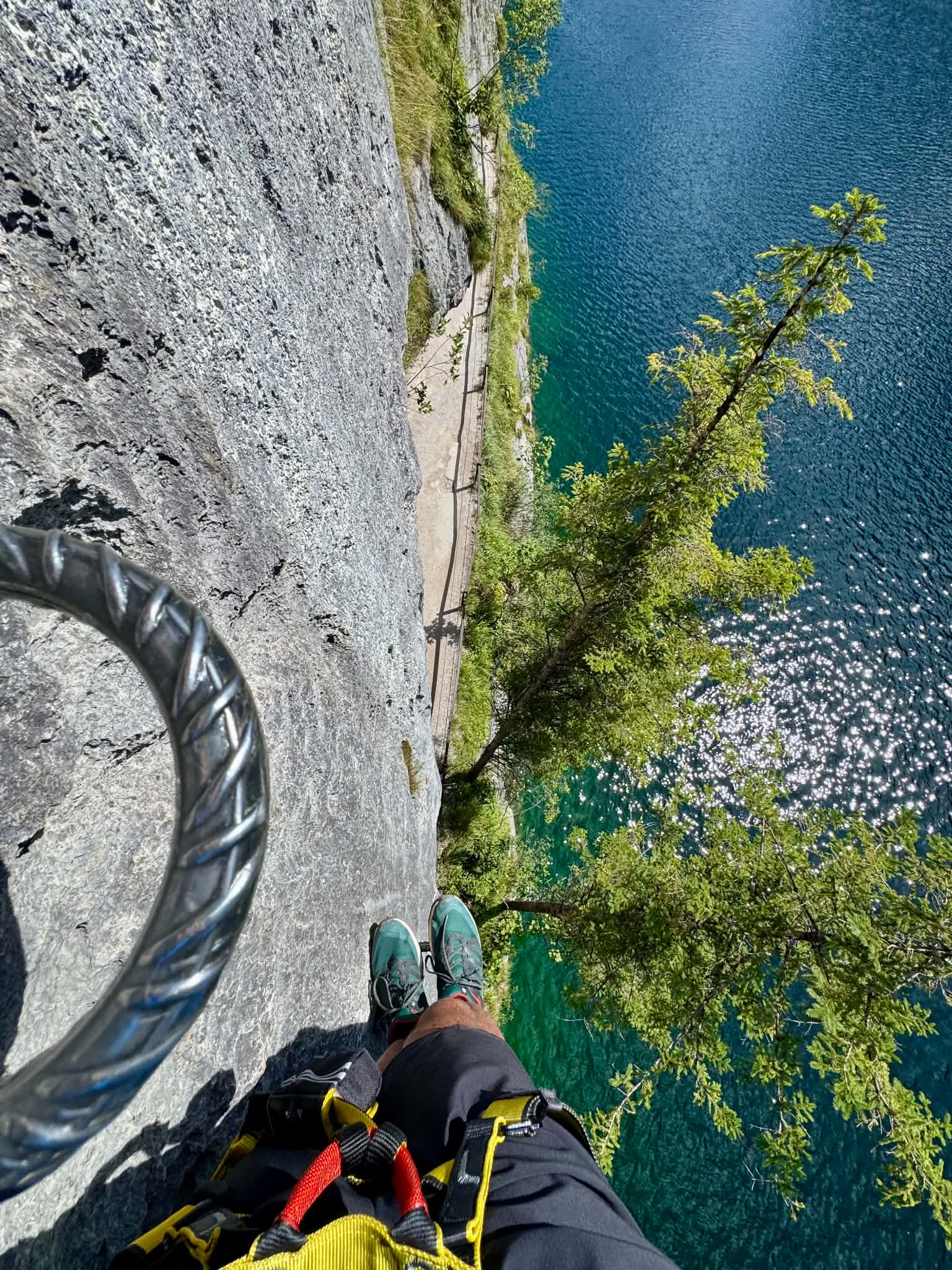 View from a via ferrata above a turquoise lake